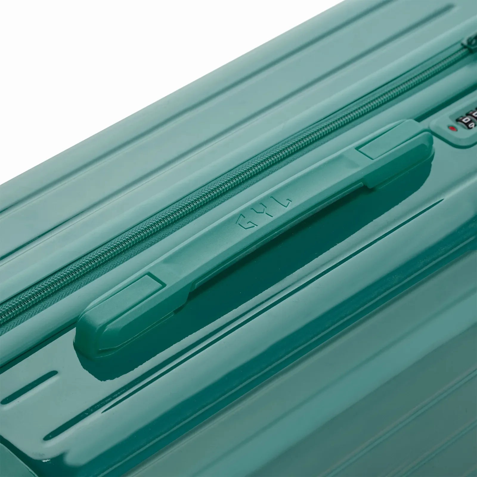 Rigid top handle of the GYL Intemporelle water green suitcase with embossed logo on top. #couleur_vert