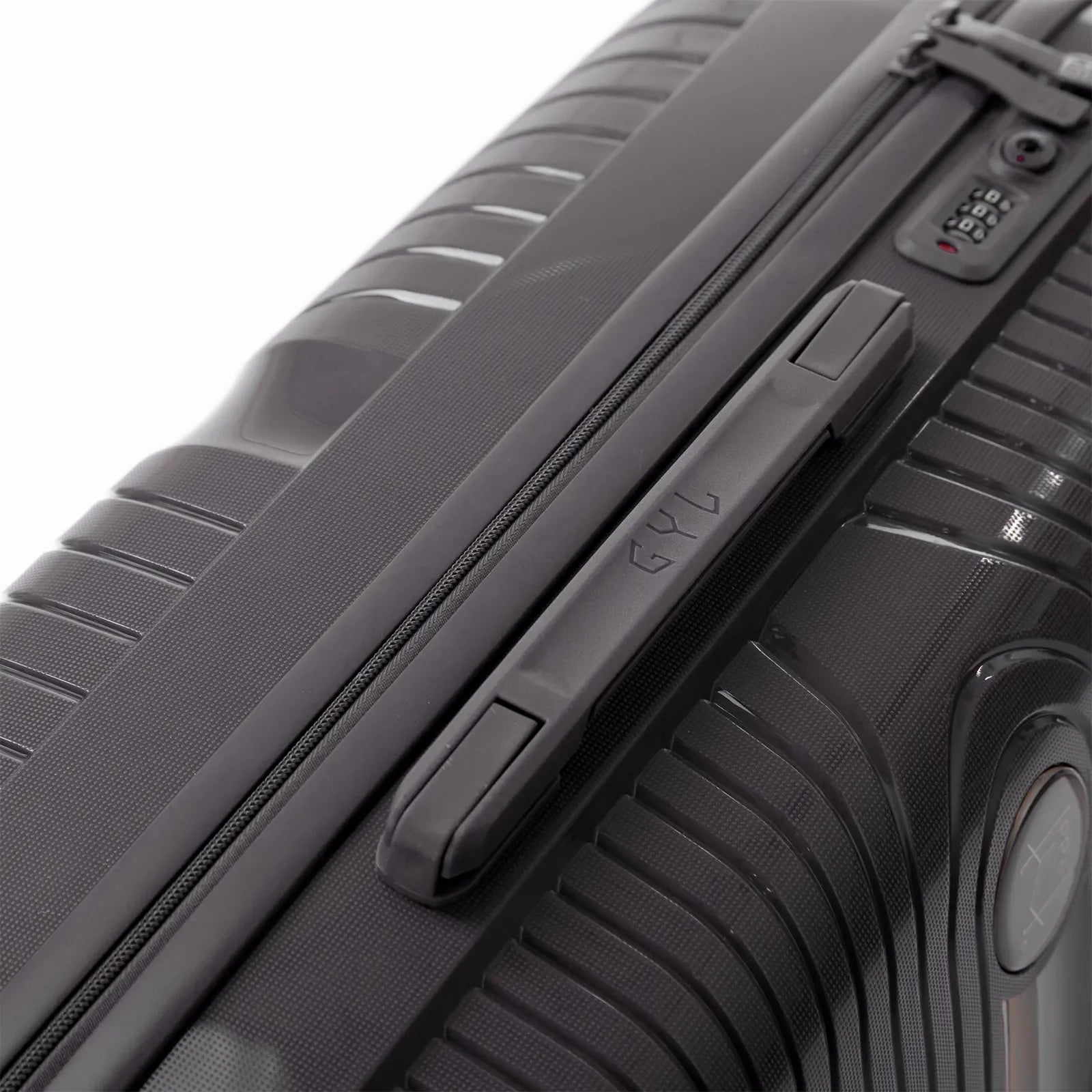 Detail of the side handle and GYL logo on the silver Signature suitcase. #couleur_argent