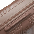 Detail of the side handle and GYL logo on the champagne Signature suitcase. #couleur_champagne