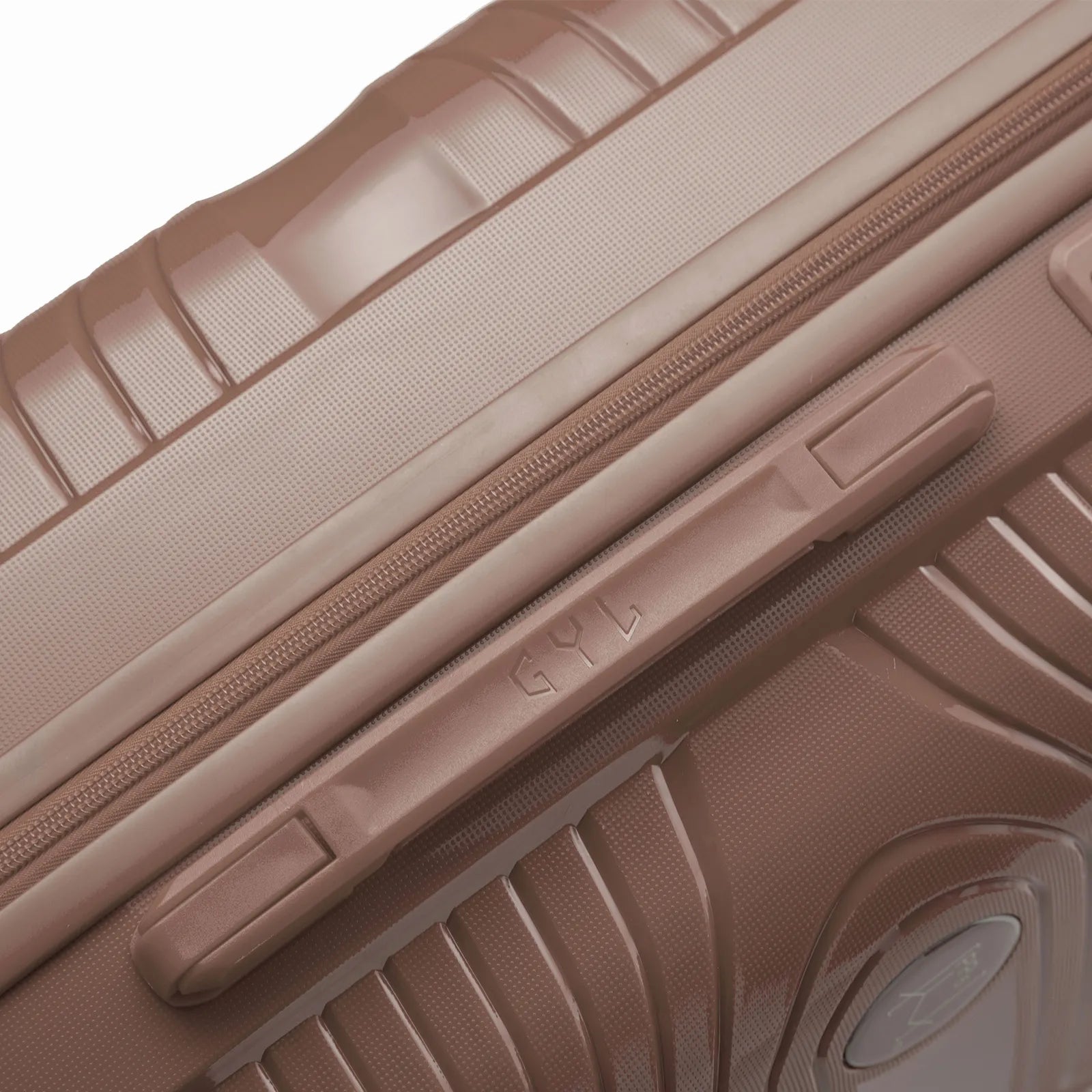 Detail of the side handle and GYL logo on the champagne Signature suitcase. #couleur_champagne