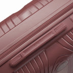 Detail of the side handle and GYL logo on the rose gold Signature suitcase. #couleur_rose gold