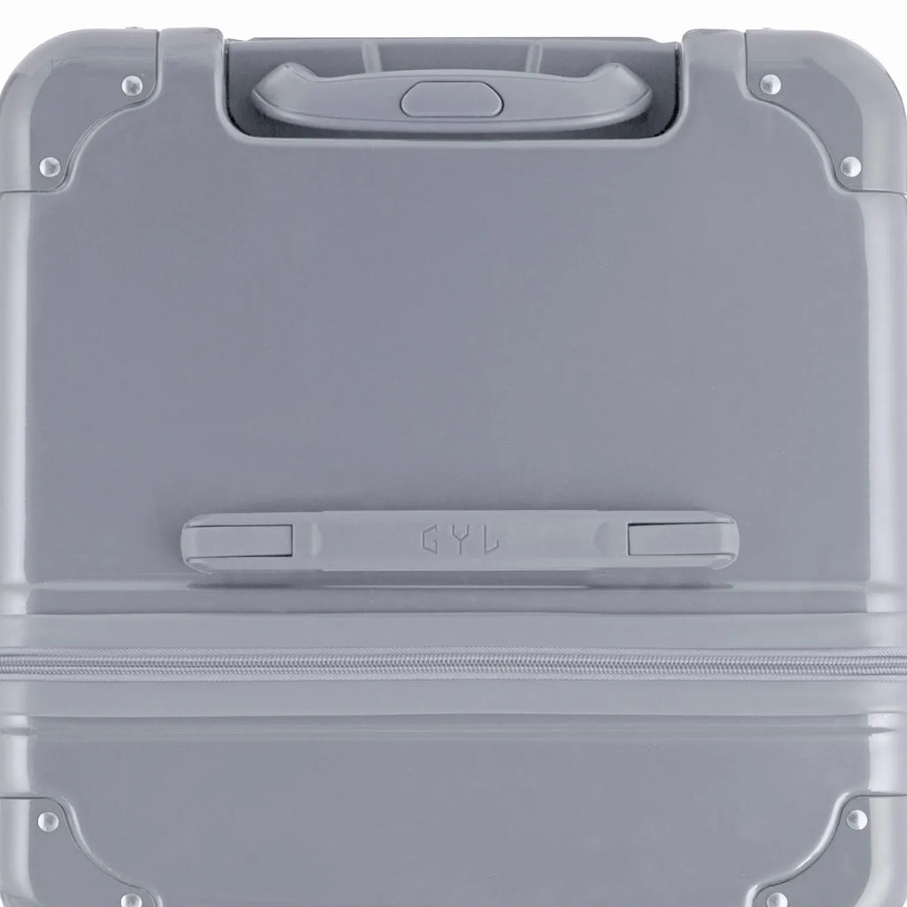 Top view of the GYL trunk suitcase in silver polycarbonate, with central handle and reinforced corners. #couleur_argent