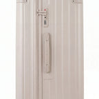 Detail of the TSA lock and side handle on the nude trunk suitcase. #couleur_nude