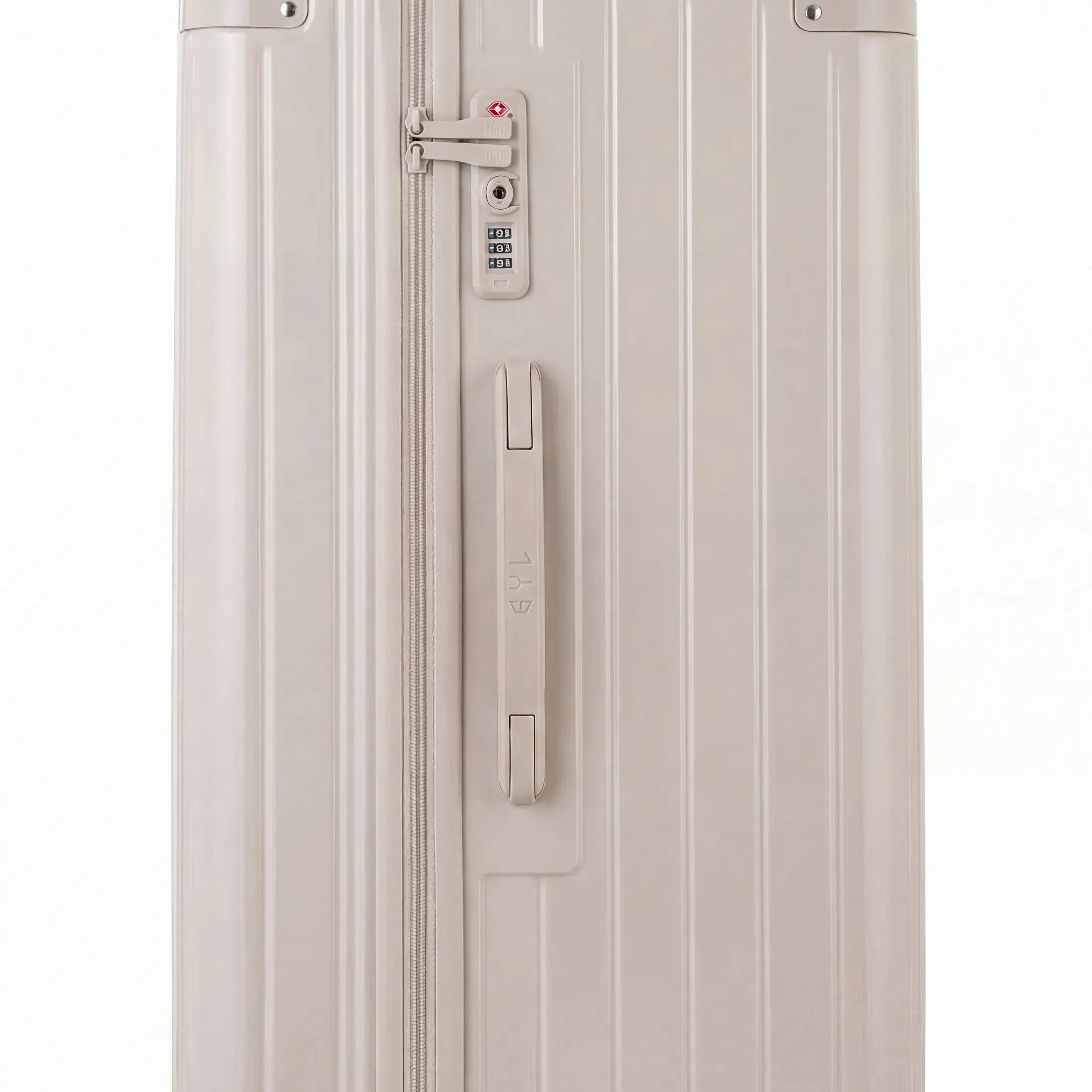 Detail of the TSA lock and side handle on the nude trunk suitcase. #couleur_nude