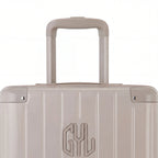 Close-up of the trolley handle and GYL logo on the nude trunk suitcase. #couleur_nude