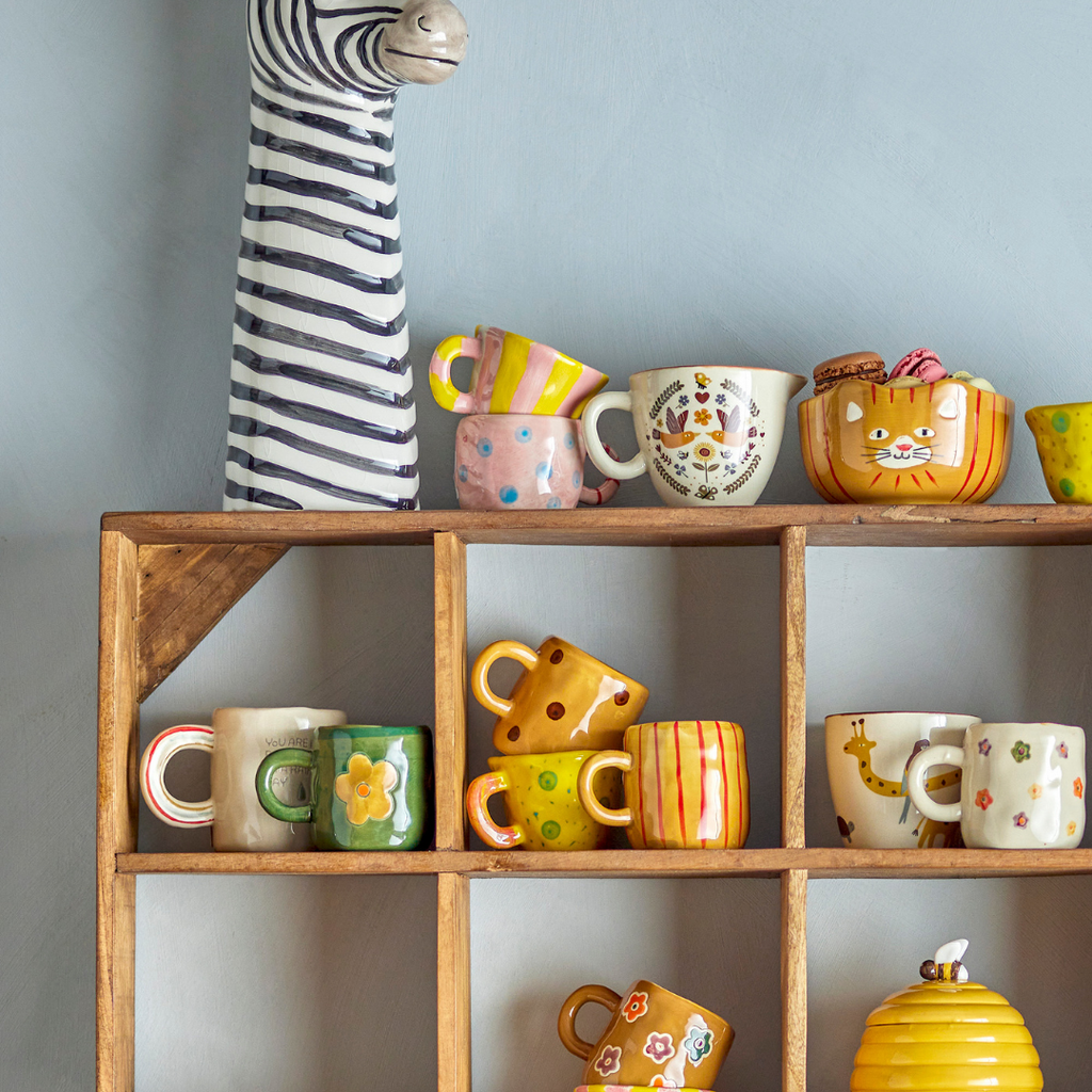 Selection of colourful Inside decorative mugs 