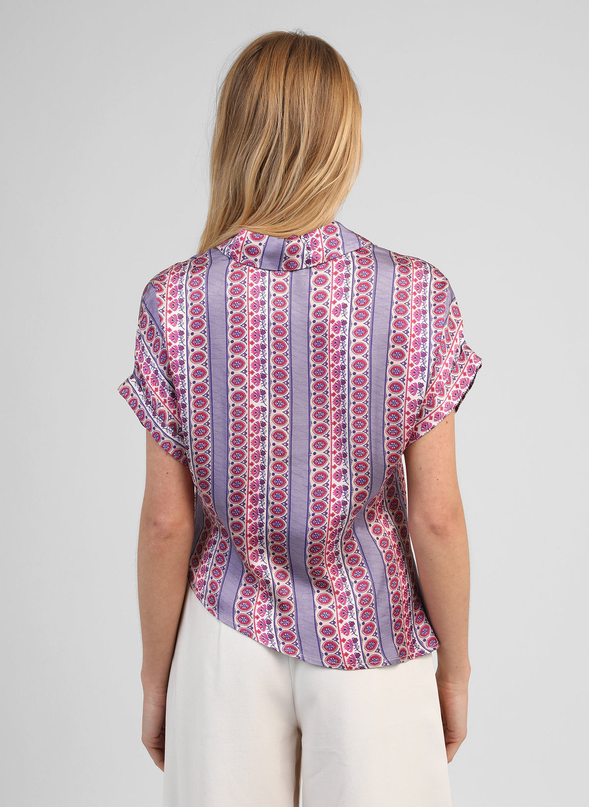 An'ge – Kaviny Diagola Ink Shirt, back view of blonde woman wearing a colourful patterned blouse