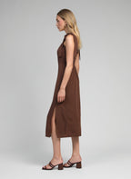 An'ge – Mantia Brown Midi Dress, model in profile wearing a brown dress with heeled sandals