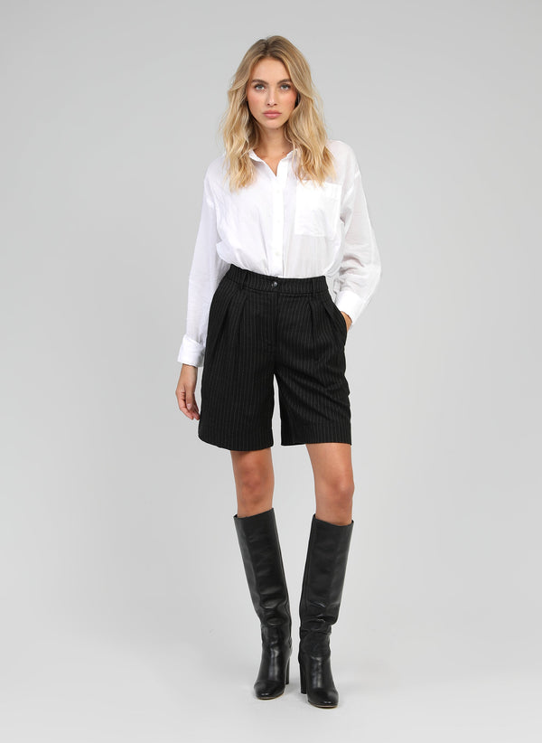 An'ge – Pamio Black Trousers, blonde female model wearing a white shirt and black striped shorts