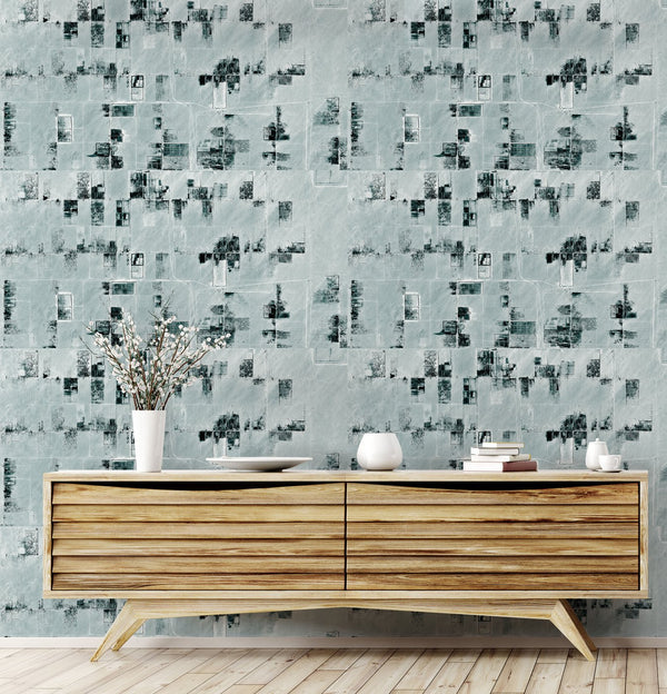 Lé Papiers De Ninon – Panoramic Wallpaper Land - Green, a light wood piece of furniture with decorative objects in front of a textured wall