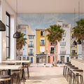 Lé Papiers De Ninon – Tapeta Panoramiczna Lisboa - Multicolore, sala restauracyjna z dużą tapetą ścienną przedstawiającą kolorowe kamienice