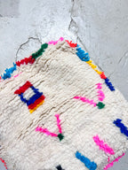 Pouf berbero marocchino écru con motivi colorati