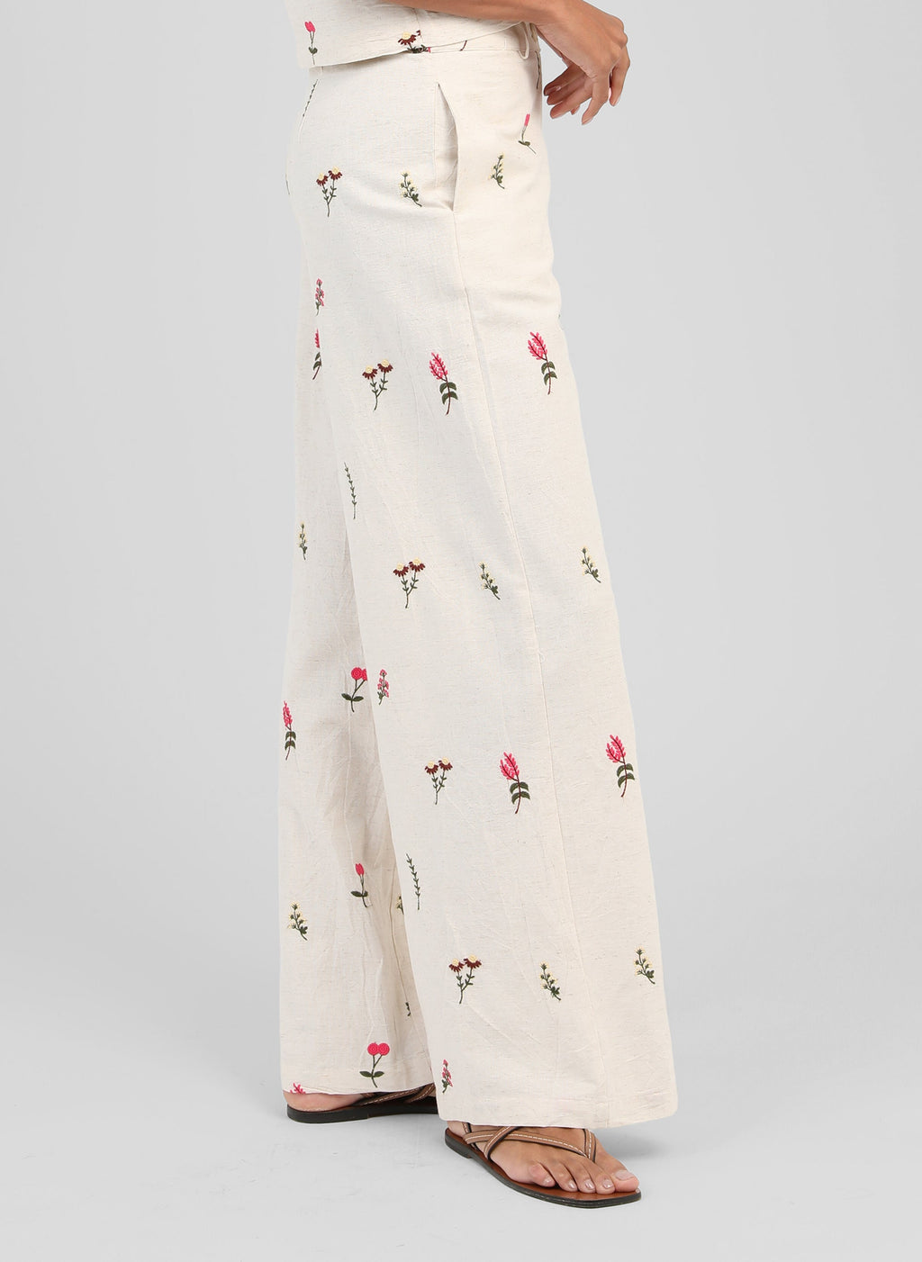 An'ge – Raiponce Trousers Ecru, ecru wide-leg trousers with pink and green floral print, side view