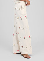 An'ge – Raiponce Trousers Ecru, ecru wide-leg trousers with pink and green floral print, side view