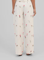 An'ge – Raiponce Trousers Ecru, ecru wide-leg trousers with pink and green floral print, back view