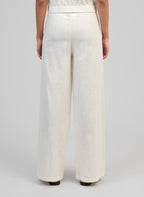 An'ge – Rossalie Trousers Ecru, off-white wide-leg linen trousers worn from behind by a model