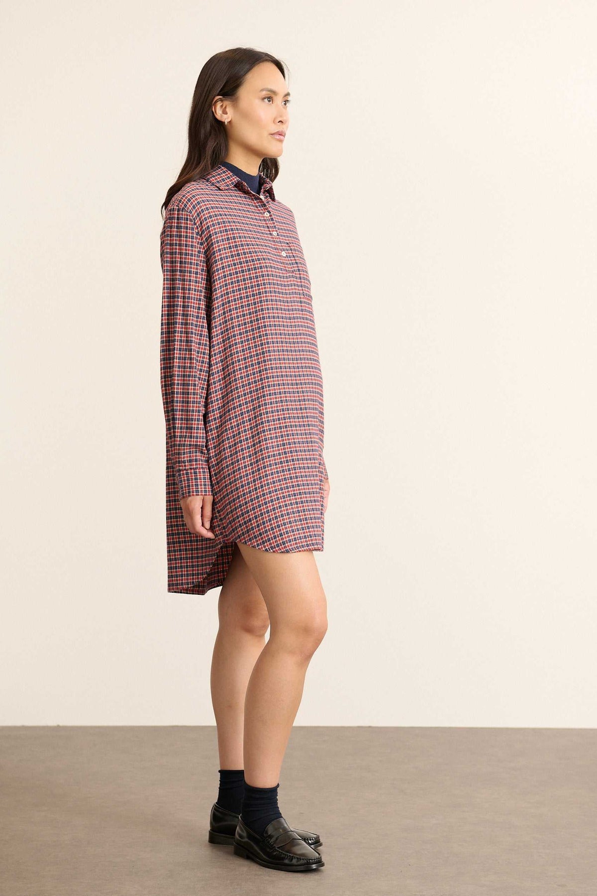 Chest patch pockets for the BALMA dress, placed on the left side, stitched finishes with flaps matching the check pattern.