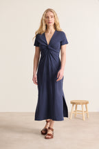 Midi dress with bow at the front, V-neck, short sleeves, close-fitting cut with slits on the sides, navy color