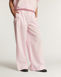 Wide pants in light pink poplin, straight and fluid cut, in cotton, offering a relaxed and comfortable fit for women.