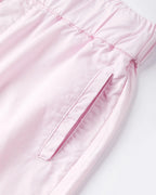 Women's jeans in light pastel pink poplin with elasticated waistband, straight cut and soft fabric suitable for all body shapes.
