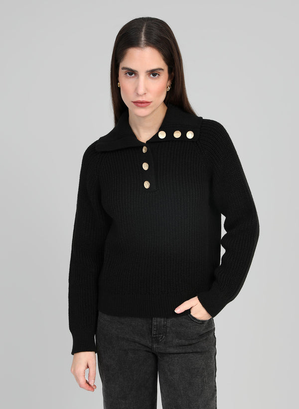 An'ge – Venise Noir Jumper, black ribbed knit jumper worn by a woman, front view