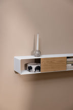 Hängekonsole SION an einer Wand, minimalistisches Design mit Holzschublade und Dekoration.