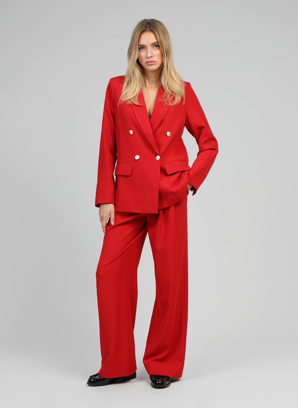 An'ge – Zakie Red Jacket, female model wearing a red blazer and trouser suit