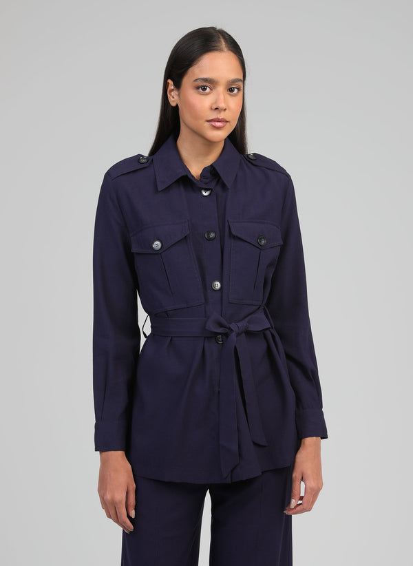 An'ge – Zoana Marine Jacket, model wearing a navy blue safari jacket with tie belt