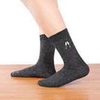 Silver black lurex knee high socks. Festive motif embroidered on the side: glasses of champagne.