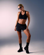 kvinna som bär sport-bh hastko BRA N°38 #color_true-black