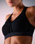 kvinna som bär sport-bh hastko BRA N°38 #color_true-black
