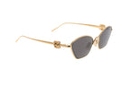 Luxury Eyewear – Sonnenbrillen - Loewe, goldfarbene Sonnenbrille mit dunklen Gläsern auf weißem Hintergrund