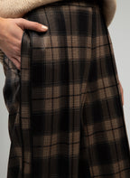 An'ge – Patrila Trousers Brown, brown and black check trousers worn by a model, detail view