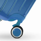 Rueda doble 360° de la maleta GYL Intemporelle azul grisáceo con grabado del logo GYL en el cubo. #couleur_bleu grisé