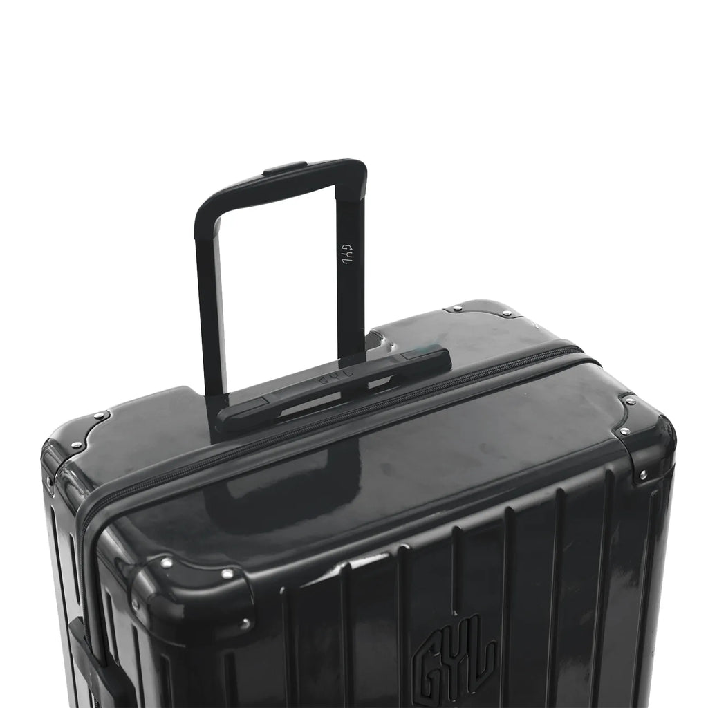 Asa trolley telescópica GYL desplegada en la maleta Intemporelle gris oscuro de policarbonato. #couleur_gris foncé