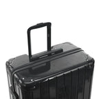 Asa trolley telescópica GYL desplegada en la maleta Intemporelle gris oscuro de policarbonato. #couleur_gris foncé