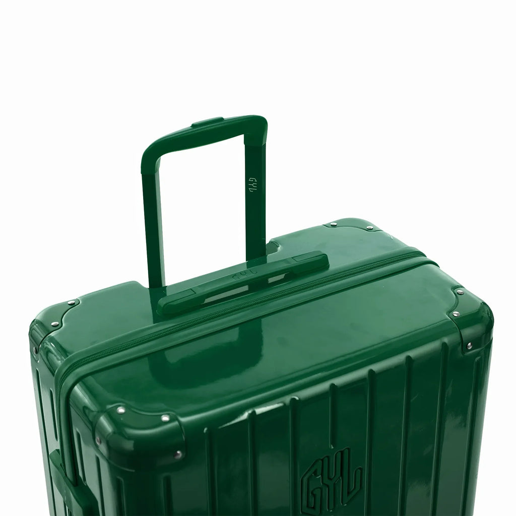Asa trolley telescópica GYL desplegada en la maleta Intemporelle verde abeto de policarbonato. #couleur_sapin