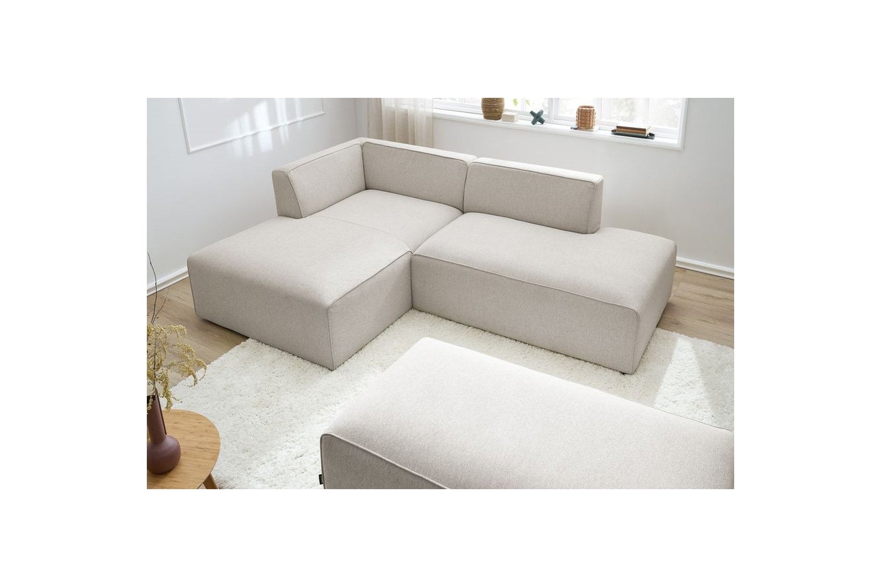 Sofá esquinero fijo modular MEGEVE de tela lisa con puf - Ángulo izquierdo - BOBOCHIC - The Bradery